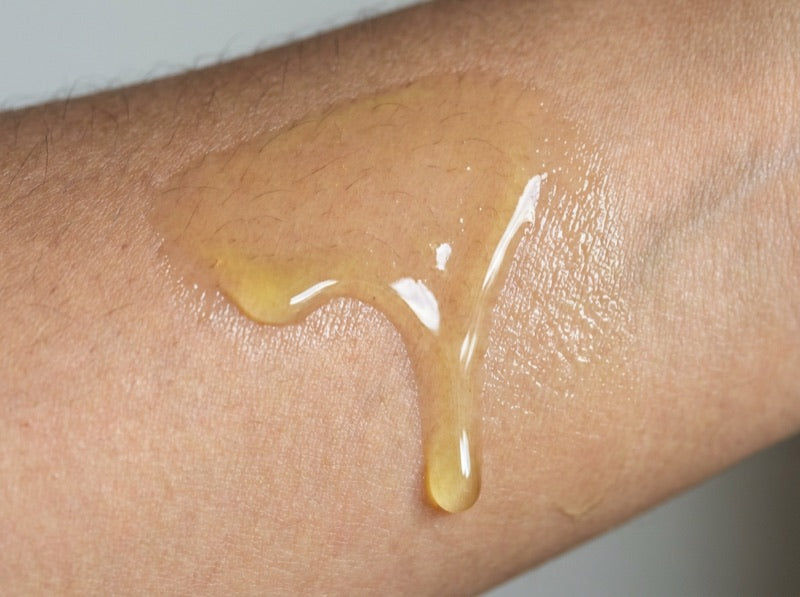 Greasy conventional body oil film on skin