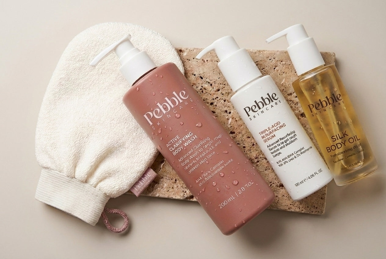 The full Pebble routine with the exfoliating glove on a stone tray